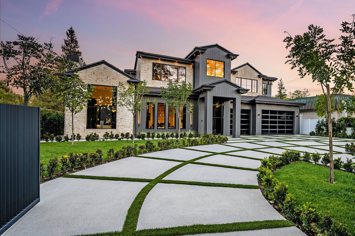 Modern luxury home exterior at sunset